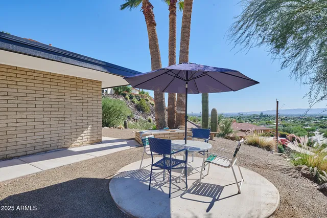 a spacious bedroom with a large bed and a large window