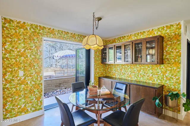 a dining room with furniture and window