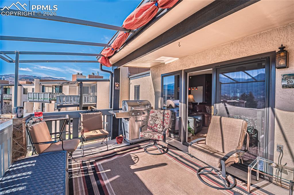 1126 Fontmore Road, Unit C Colorado Springs, CO 80904 - Photo 13 of 35 a view of a dining room with furniture window and outside view
