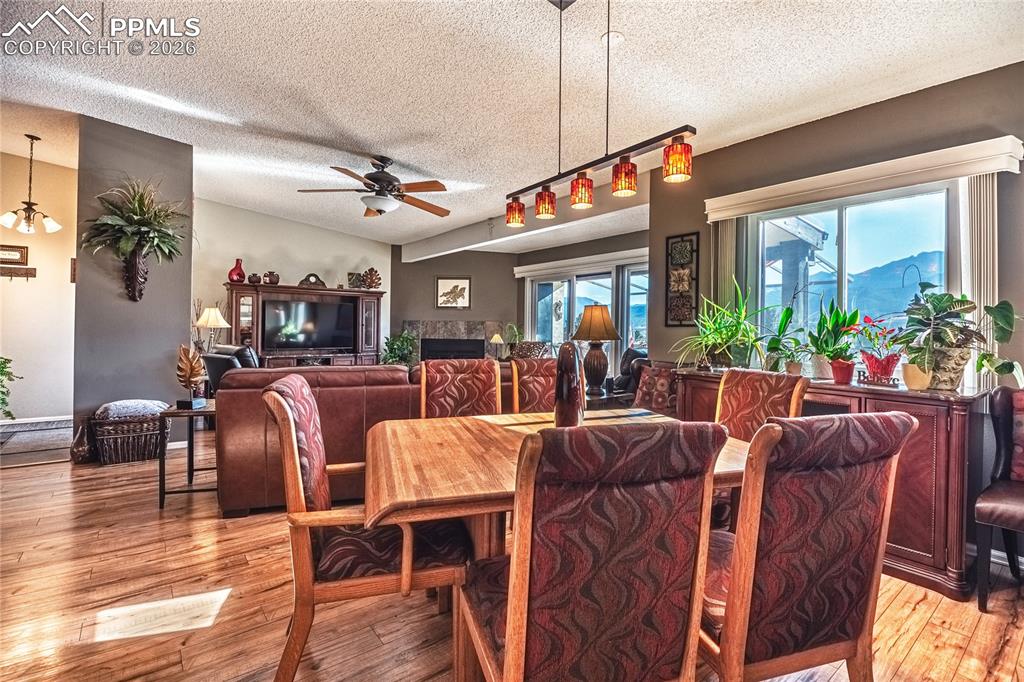 1126 Fontmore Road, Unit C Colorado Springs, CO 80904 - Photo 17 of 35 a view of a dining room with furniture window and wooden floor