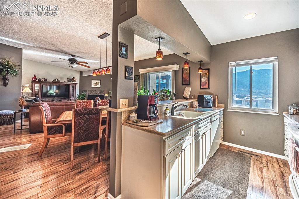 1126 Fontmore Road, Unit C Colorado Springs, CO 80904 - Photo 19 of 35 a kitchen with stainless steel appliances granite countertop a stove and a refrigerator
