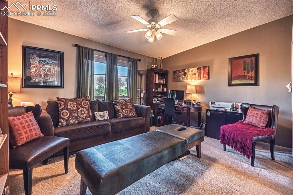 1126 Fontmore Road, Unit C Colorado Springs, CO 80904 - Photo 25 of 35 a living room with furniture a table and a potted plant