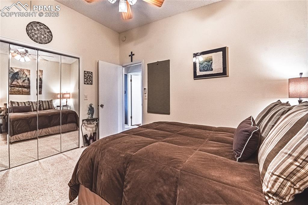 1126 Fontmore Road, Unit C Colorado Springs, CO 80904 - Photo 28 of 35 a bedroom with a bed and a lamp