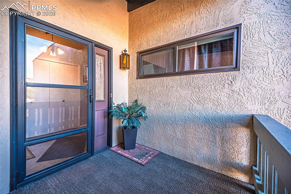 1126 Fontmore Road, Unit C Colorado Springs, CO 80904 - Photo 3 of 35 a front view of a house with a yard