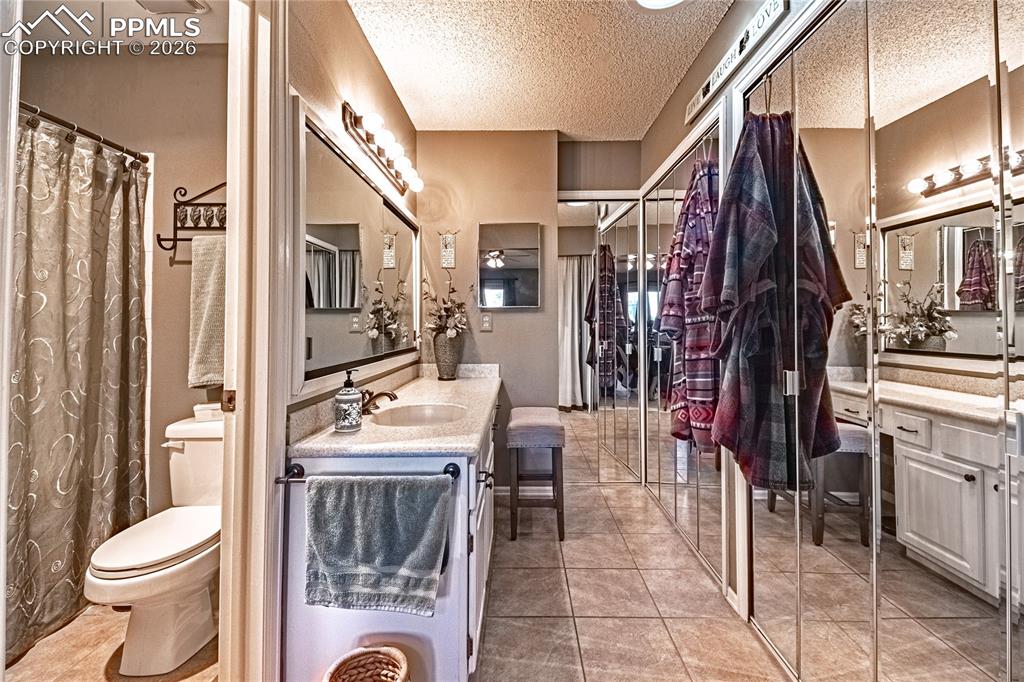 1126 Fontmore Road, Unit C Colorado Springs, CO 80904 - Photo 32 of 35 a bathroom with a sink toilet and shower