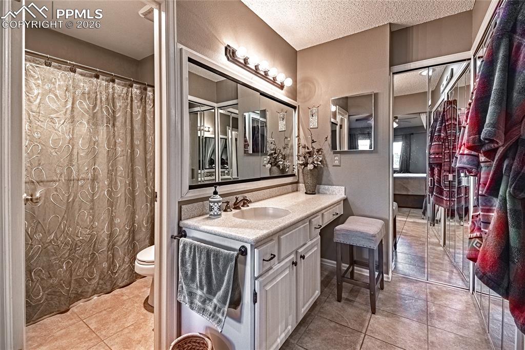 1126 Fontmore Road, Unit C Colorado Springs, CO 80904 - Photo 33 of 35 a bathroom with a sink a vanity and a mirror