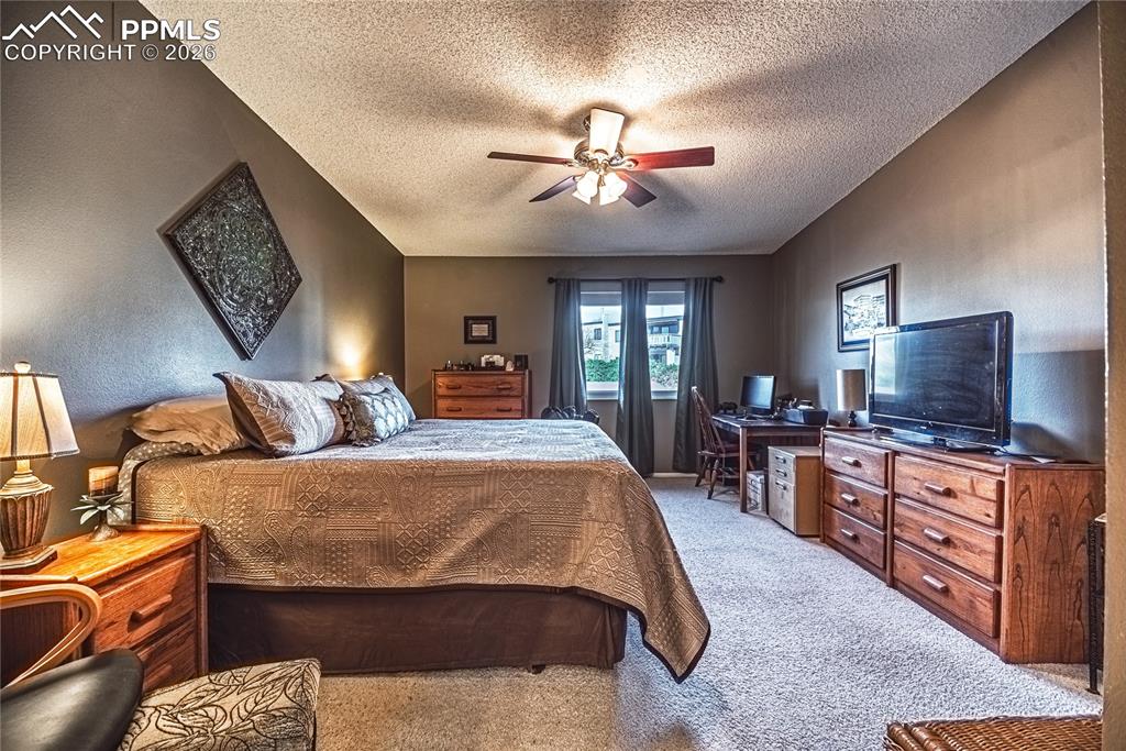 1126 Fontmore Road, Unit C Colorado Springs, CO 80904 - Photo 34 of 35 a bed room with a bed and a television