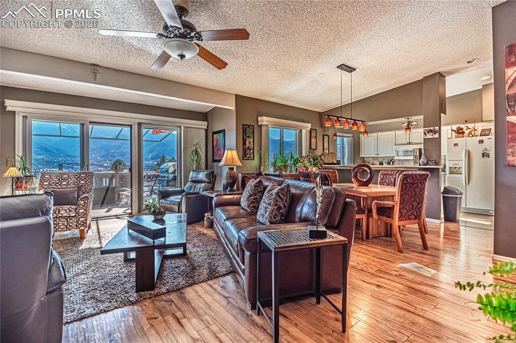 1126 Fontmore Road, Unit C Colorado Springs, CO 80904 - Photo 6 of 35 a living room with lots of furniture and a chandelier