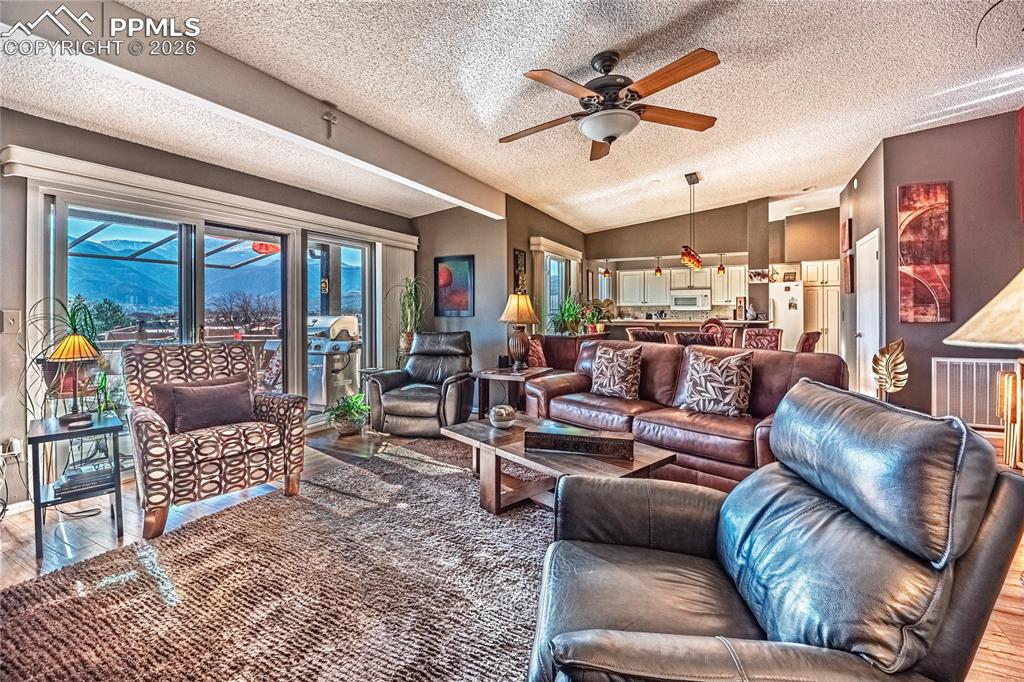 1126 Fontmore Road, Unit C Colorado Springs, CO 80904 - Photo 8 of 35 a living room with furniture ceiling fan and a rug