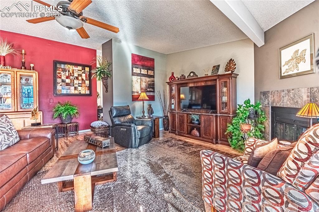1126 Fontmore Road, Unit C Colorado Springs, CO 80904 - Photo 10 of 35 a living room with furniture a flat screen tv and a dining table