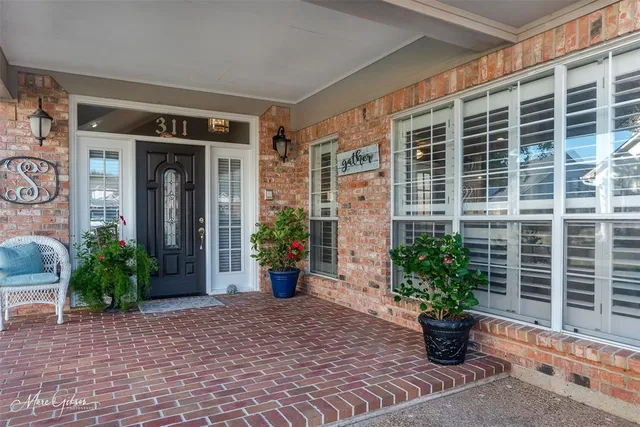 a view of potted plants in front of door