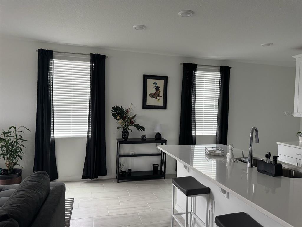 4469 Eagle Trl Bend St. Cloud, FL 34772 - Photo 3 of 13 a living room with furniture and a large window