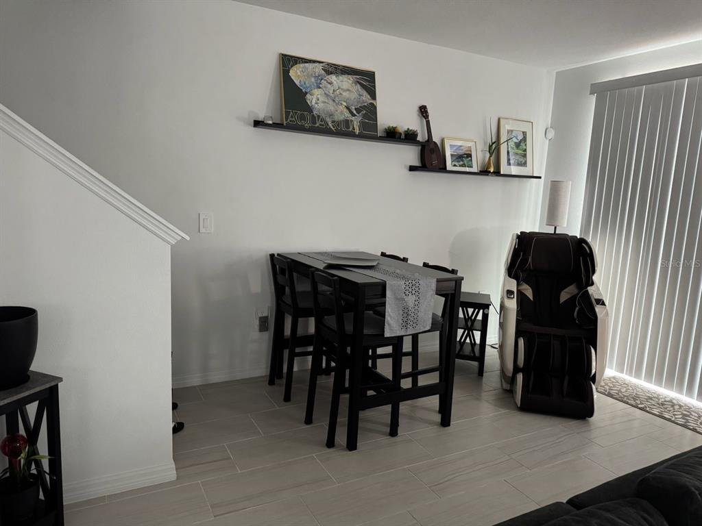 4469 Eagle Trl Bend St. Cloud, FL 34772 - Photo 5 of 13 a dining room with furniture and wooden floor