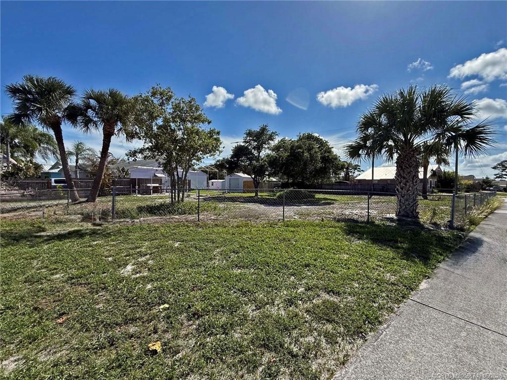 5152 Southeast Primrose Way Stuart, FL 34997 - Photo 3 of 13 a view of a yard with a fountain