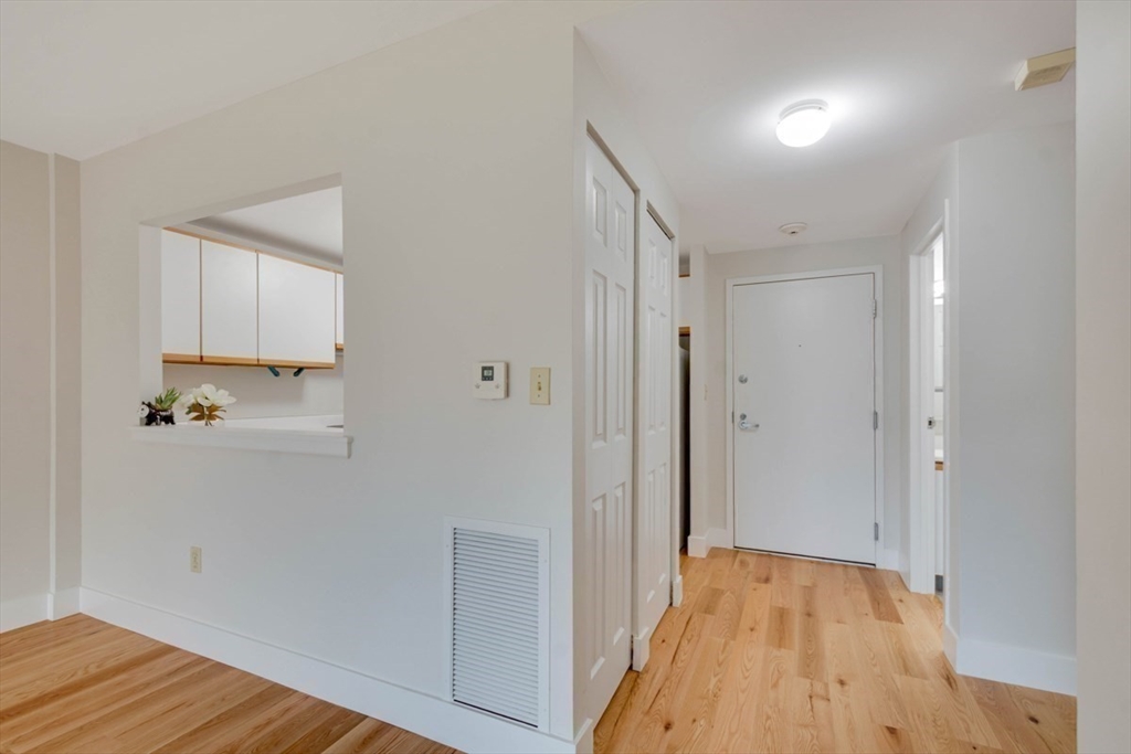 1 Watermill Place, Unit 308 Arlington, MA 02476 - Photo 11 of 27 a view of bathroom with wooden floor