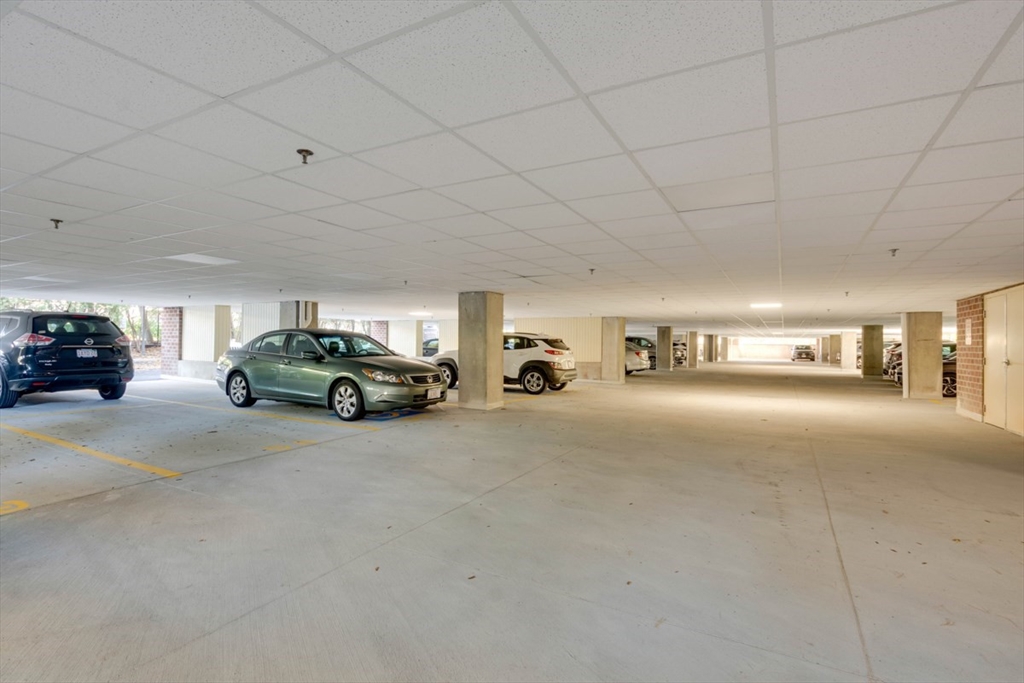 1 Watermill Place, Unit 308 Arlington, MA 02476 - Photo 26 of 27 a view of parking area with parked cars