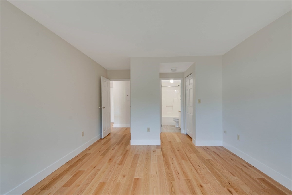1 Watermill Place, Unit 308 Arlington, MA 02476 - Photo 10 of 27 a view of empty room with wooden floor