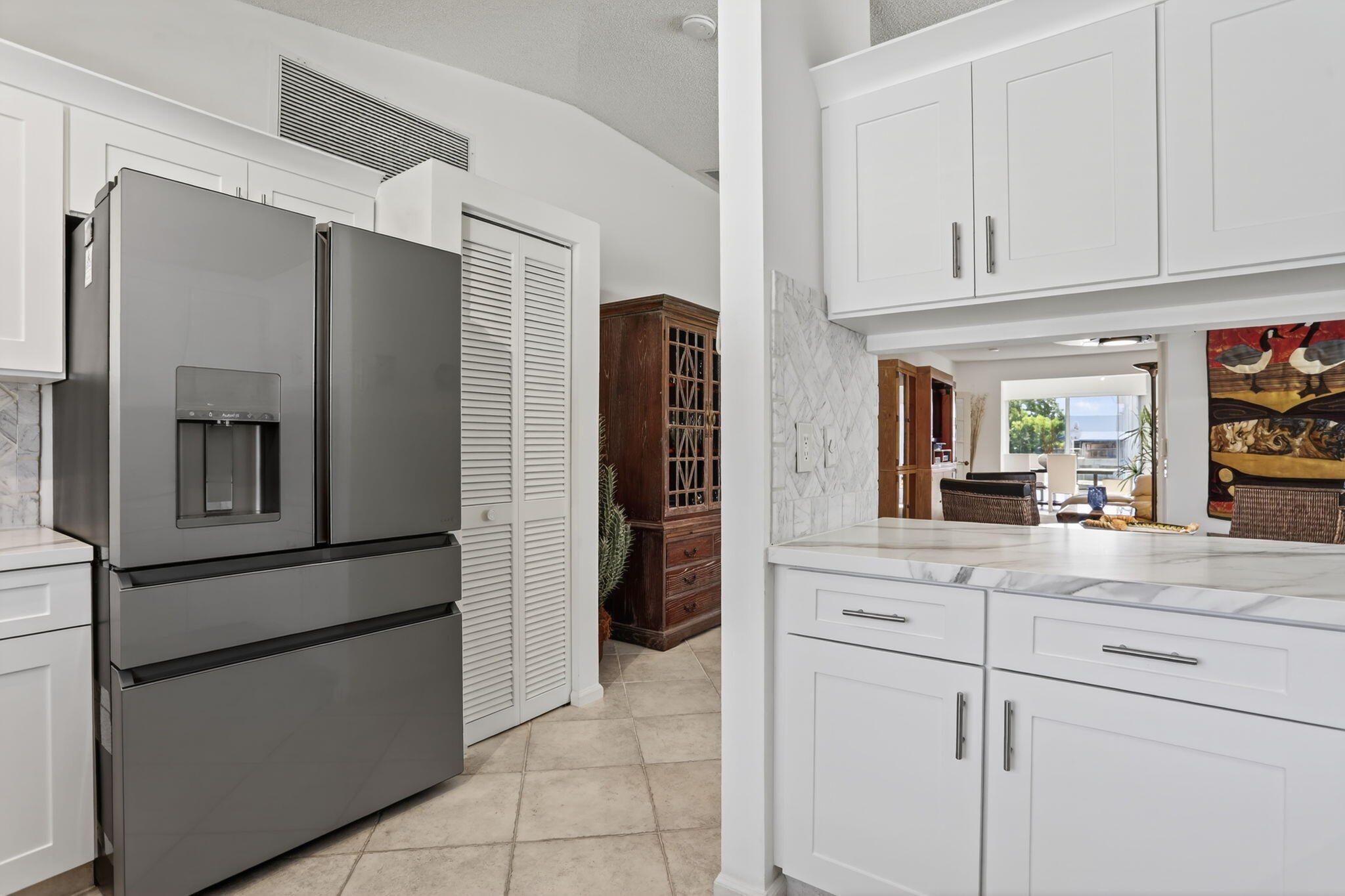 6806 Via Regina Boca Raton, FL 33433 - Photo 14 of 51 a kitchen with stainless steel appliances granite countertop white cabinets and a refrigerator