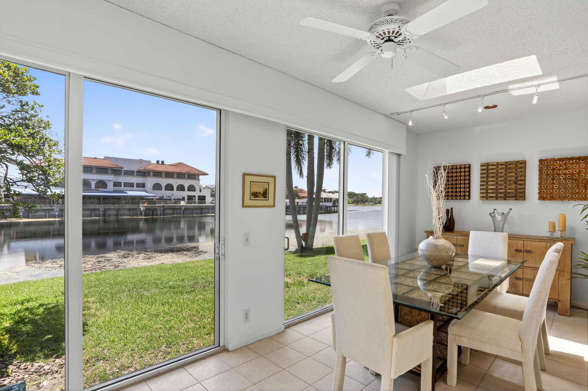 6806 Via Regina Boca Raton, FL 33433 - Photo 26 of 51 a dining room with furniture and a floor to ceiling window
