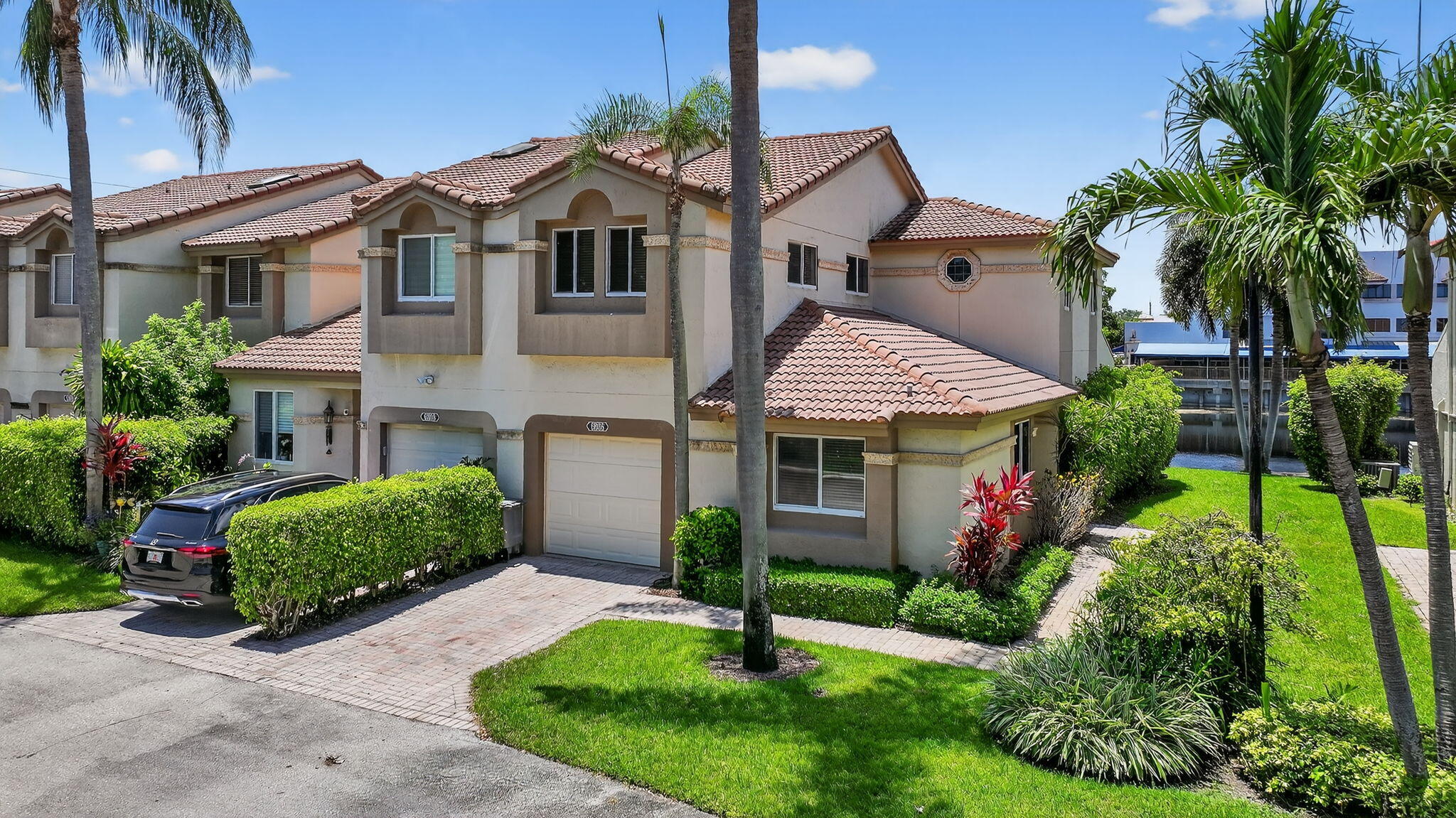 6806 Via Regina Boca Raton, FL 33433 - Photo 3 of 51 a front view of a house with a garden and plants