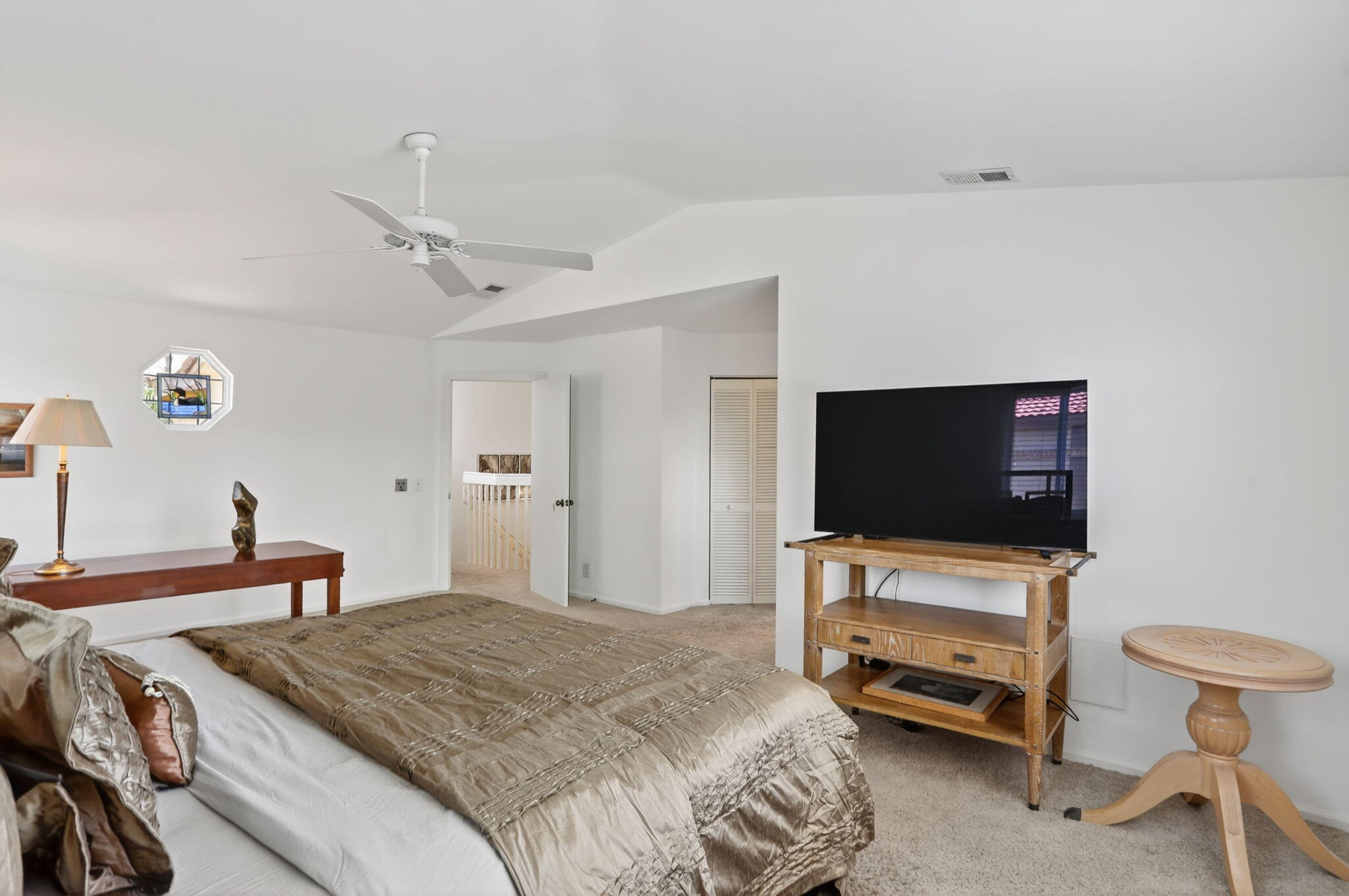 6806 Via Regina Boca Raton, FL 33433 - Photo 33 of 51 a bedroom with a bed and a flat screen tv