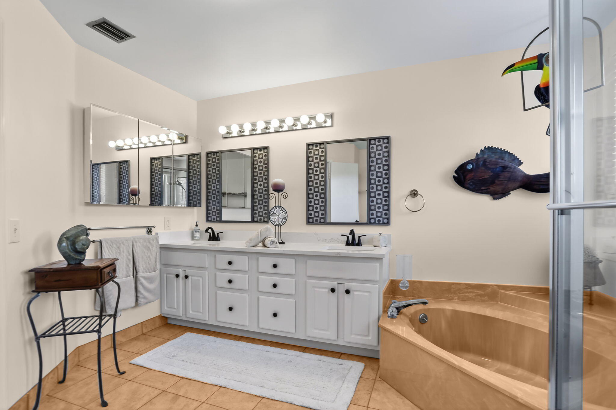 6806 Via Regina Boca Raton, FL 33433 - Photo 34 of 51 a bathroom with a tub sink and mirror