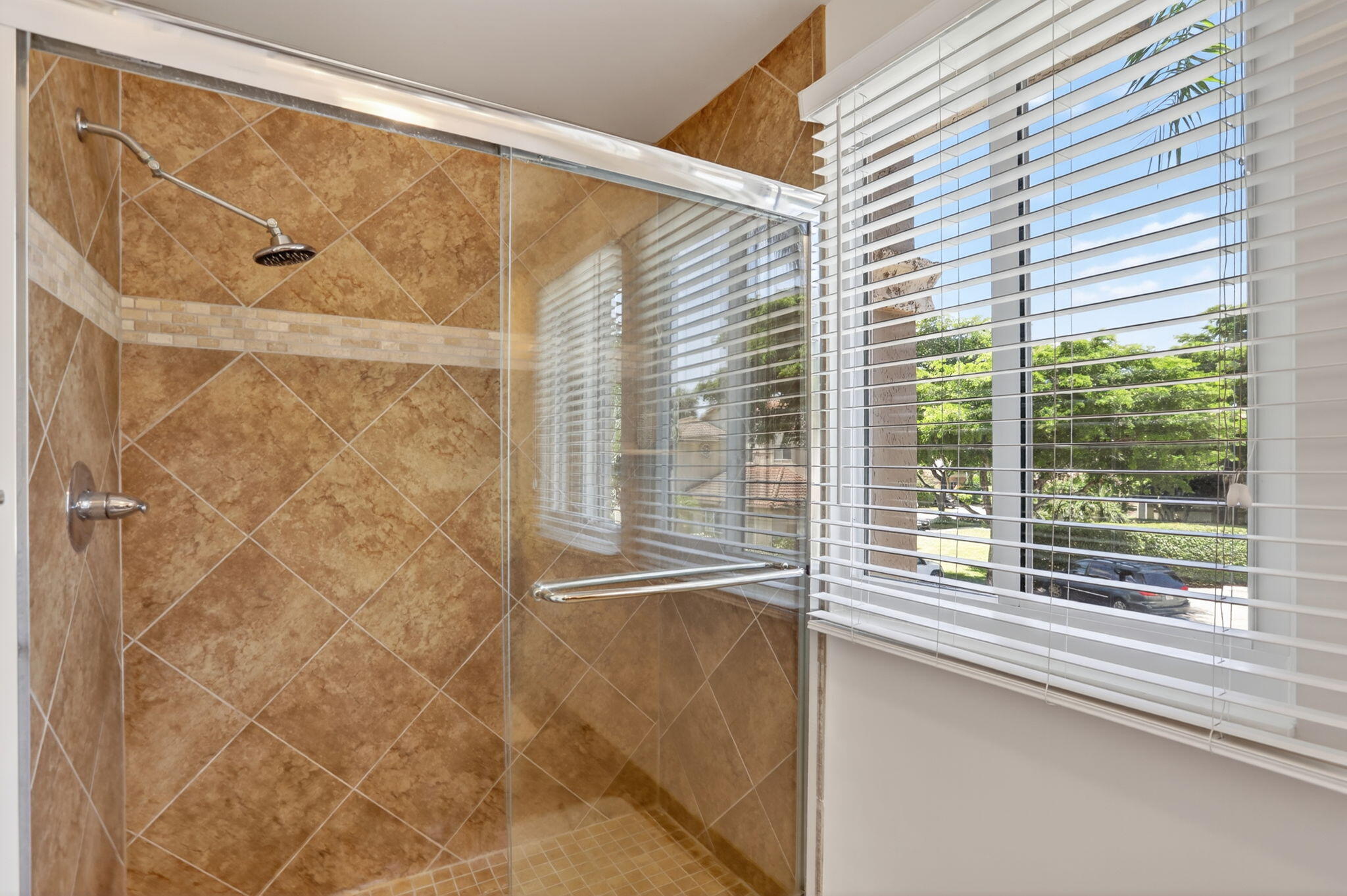 6806 Via Regina Boca Raton, FL 33433 - Photo 40 of 51 a view of a bathroom with a shower and a window