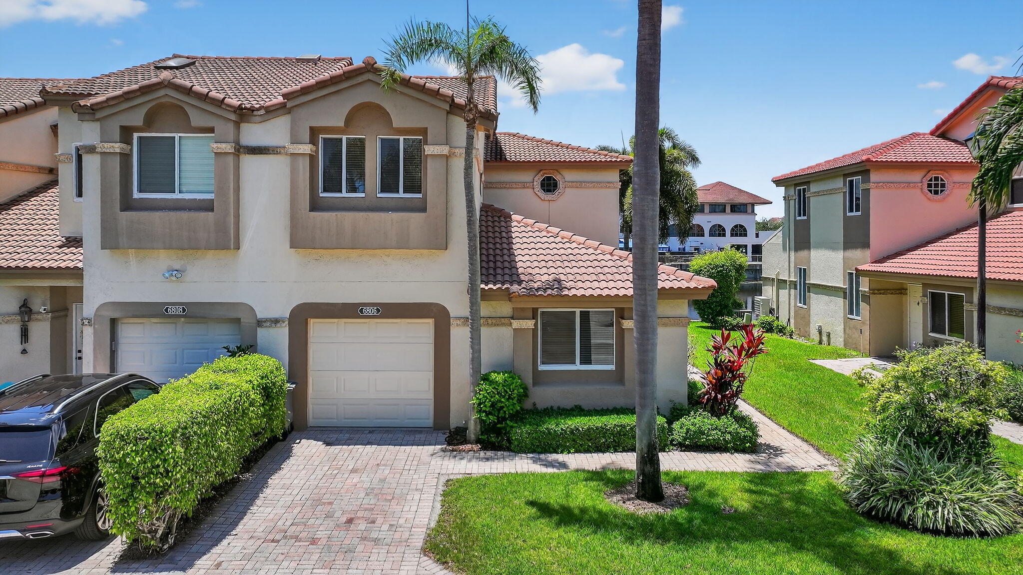 6806 Via Regina Boca Raton, FL 33433 - Photo 4 of 51 a front view of a house with garden