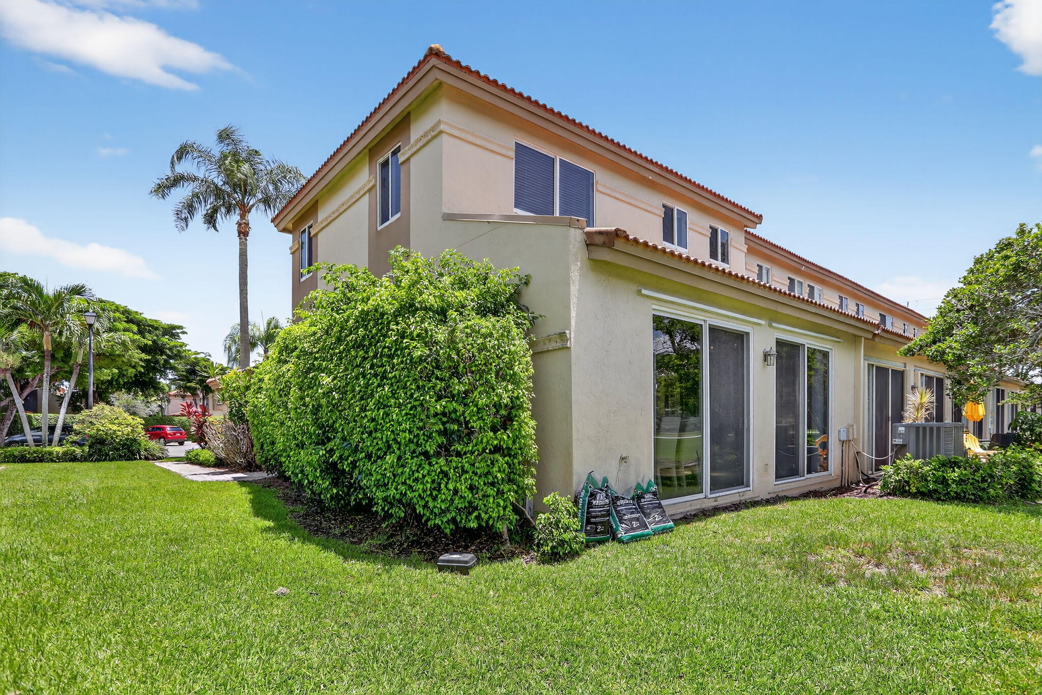 6806 Via Regina Boca Raton, FL 33433 - Photo 42 of 51 front view of a house with a yard
