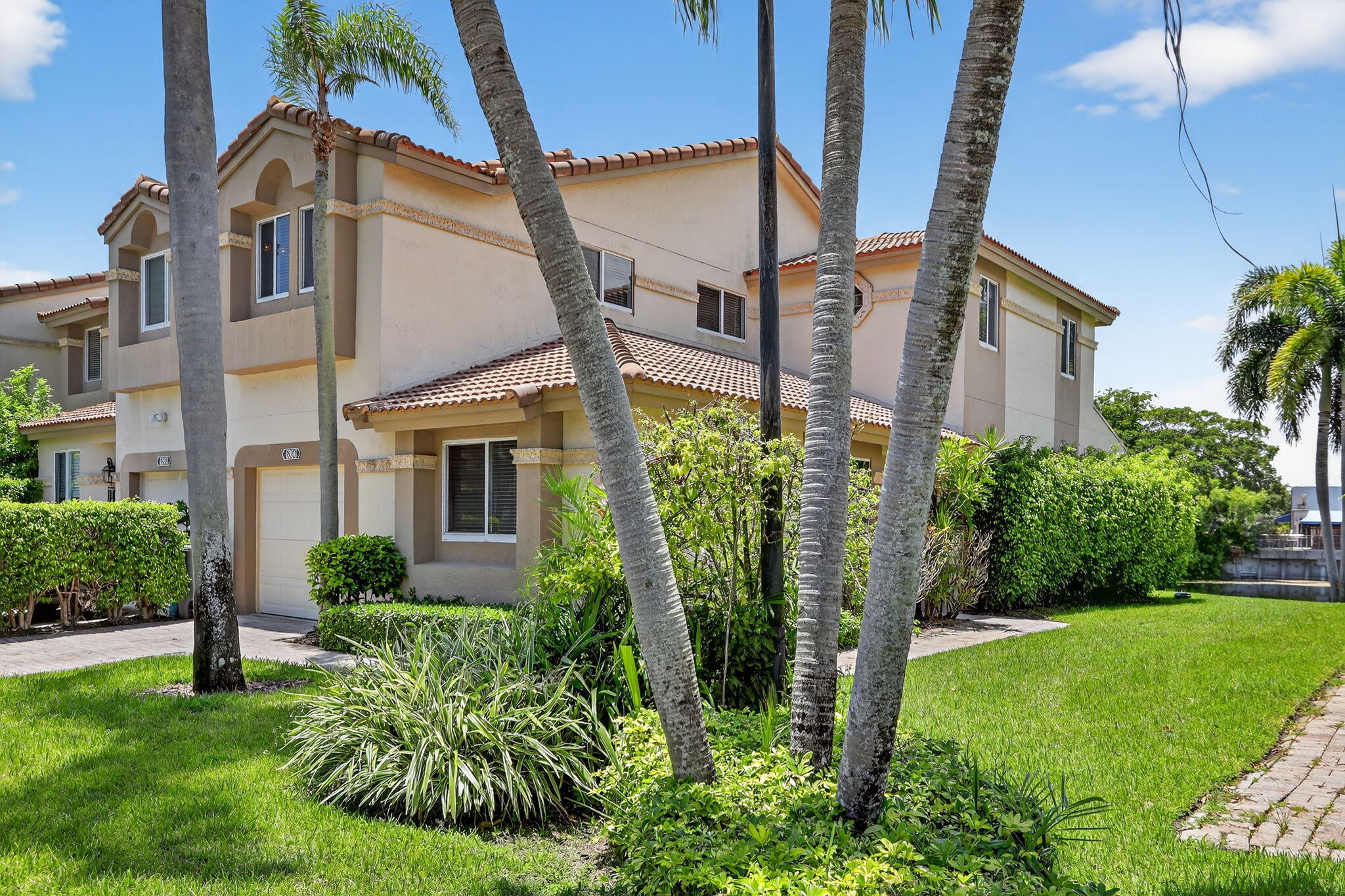6806 Via Regina Boca Raton, FL 33433 - Photo 6 of 51 a view of a white house next to a yard