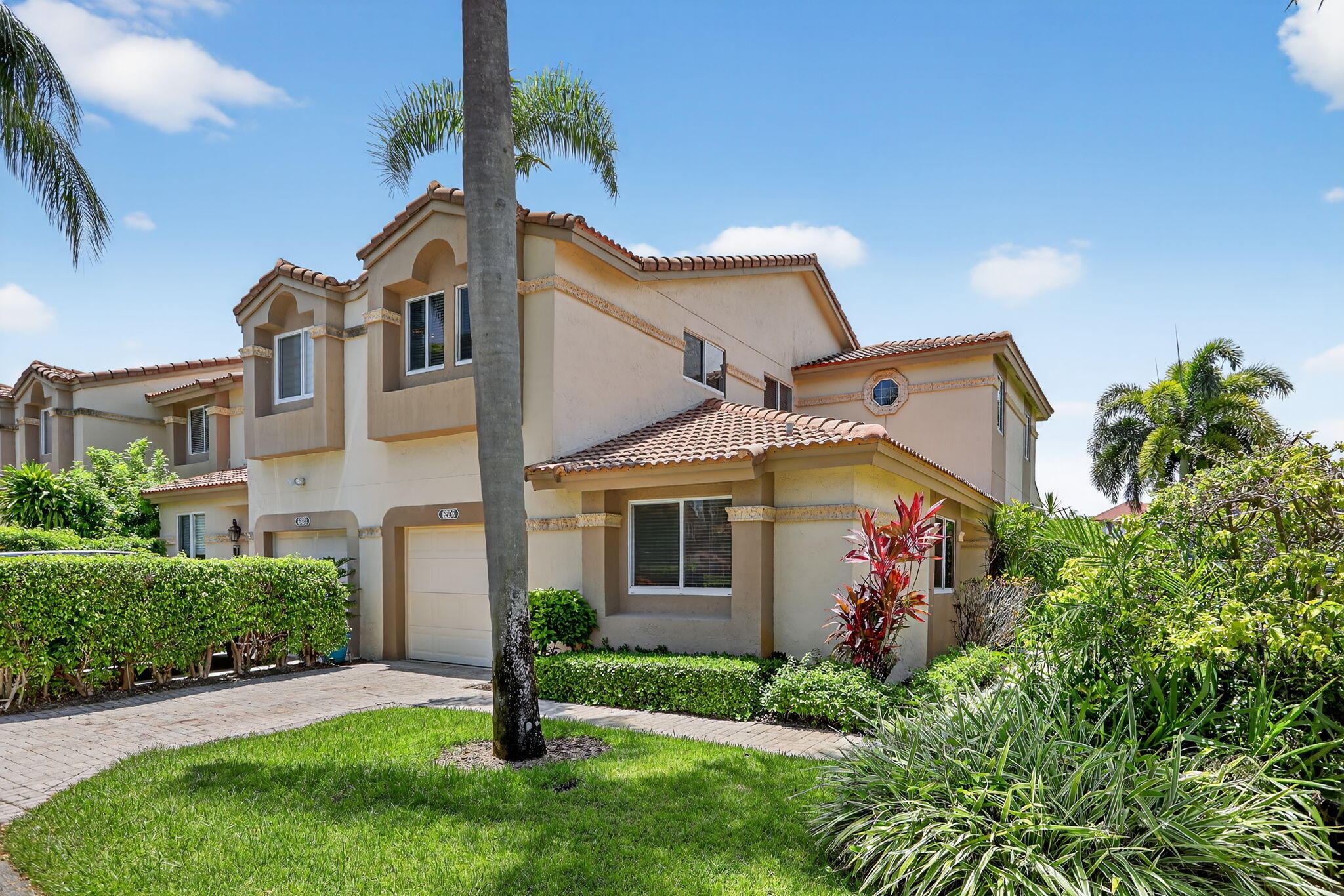 6806 Via Regina Boca Raton, FL 33433 - Photo 7 of 51 a front view of a house with a yard