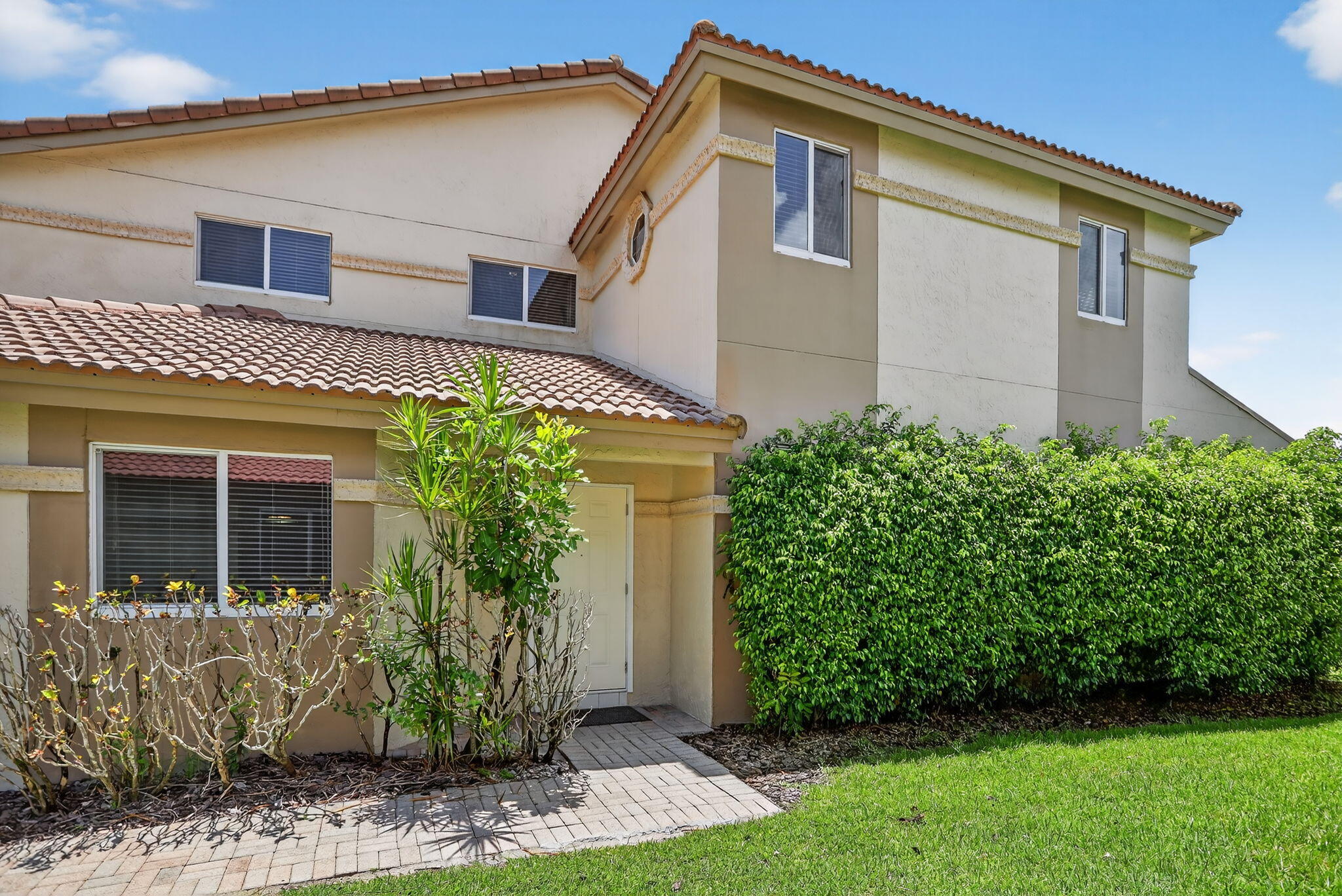 6806 Via Regina Boca Raton, FL 33433 - Photo 8 of 51 a front view of a house with garden