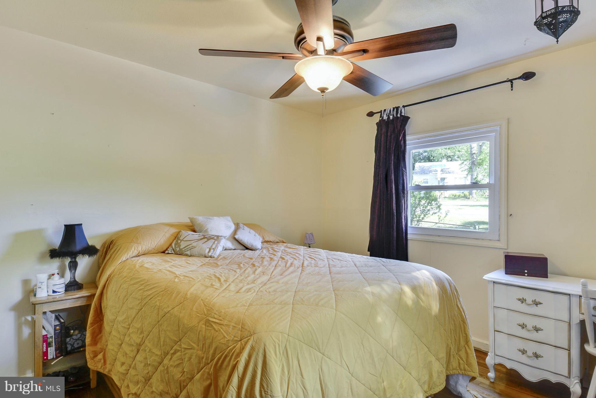 4400 Garrett Park Road Silver Spring, MD 20906 - Photo 11 of 30 a bed sitting in a bedroom next to a window