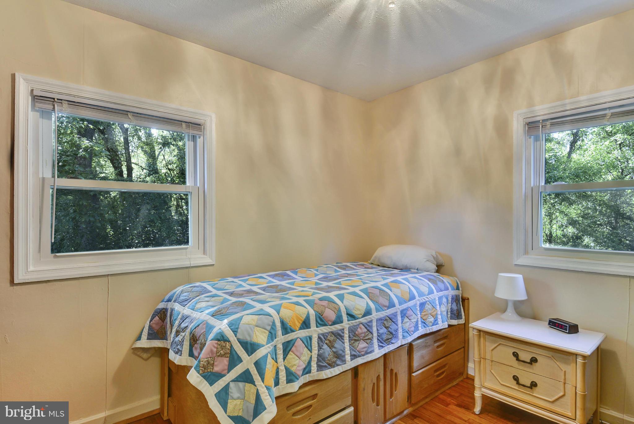 4400 Garrett Park Road Silver Spring, MD 20906 - Photo 15 of 30 a bedroom with a bed and a window