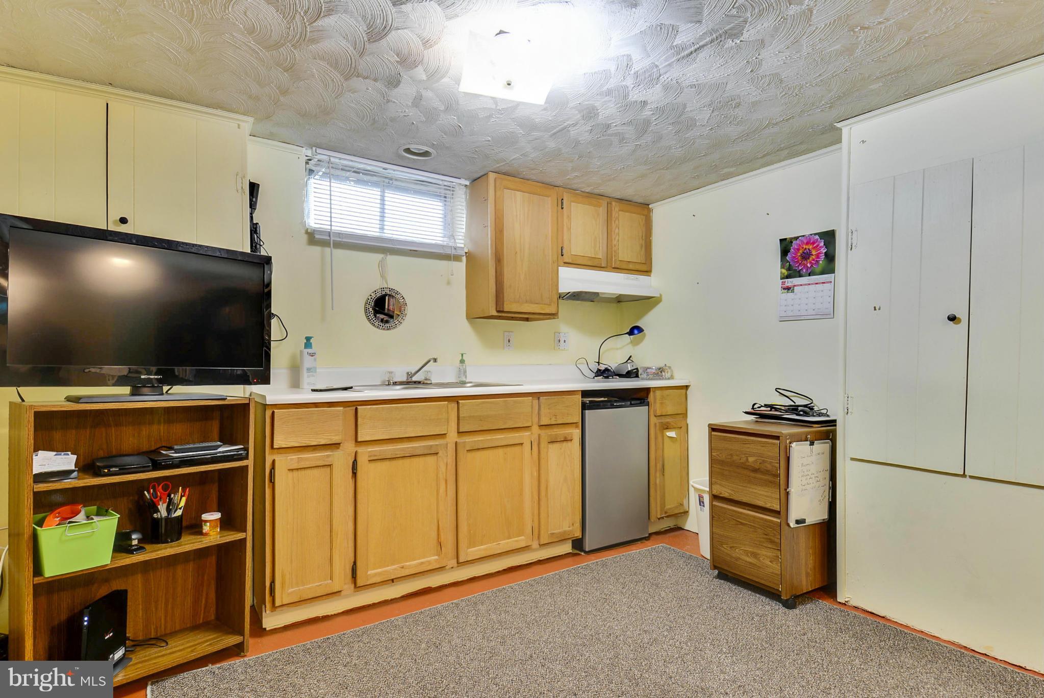 4400 Garrett Park Road Silver Spring, MD 20906 - Photo 18 of 30 a kitchen with stainless steel appliances granite countertop a sink and a stove