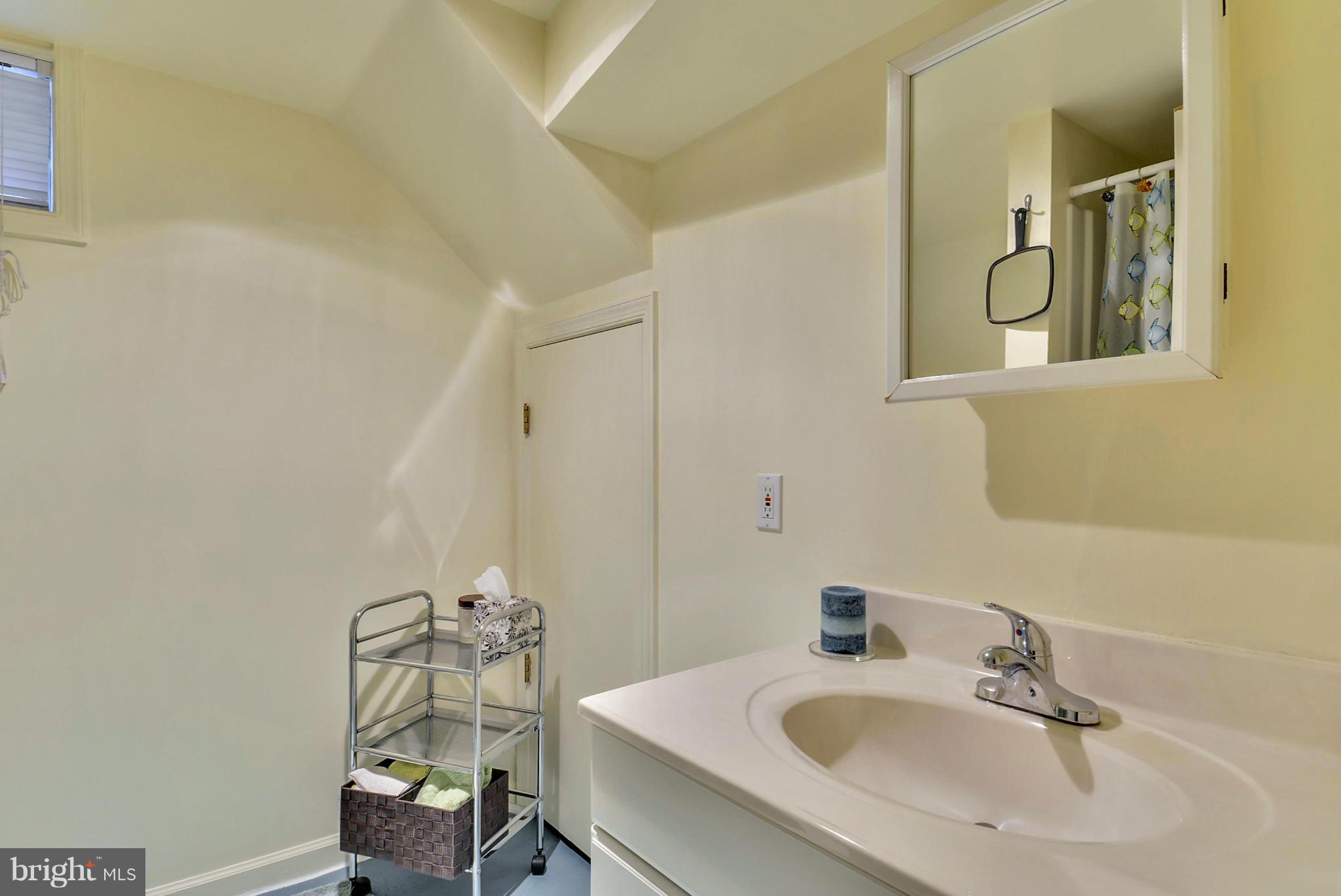 4400 Garrett Park Road Silver Spring, MD 20906 - Photo 21 of 30 a bathroom with a sink and a mirror