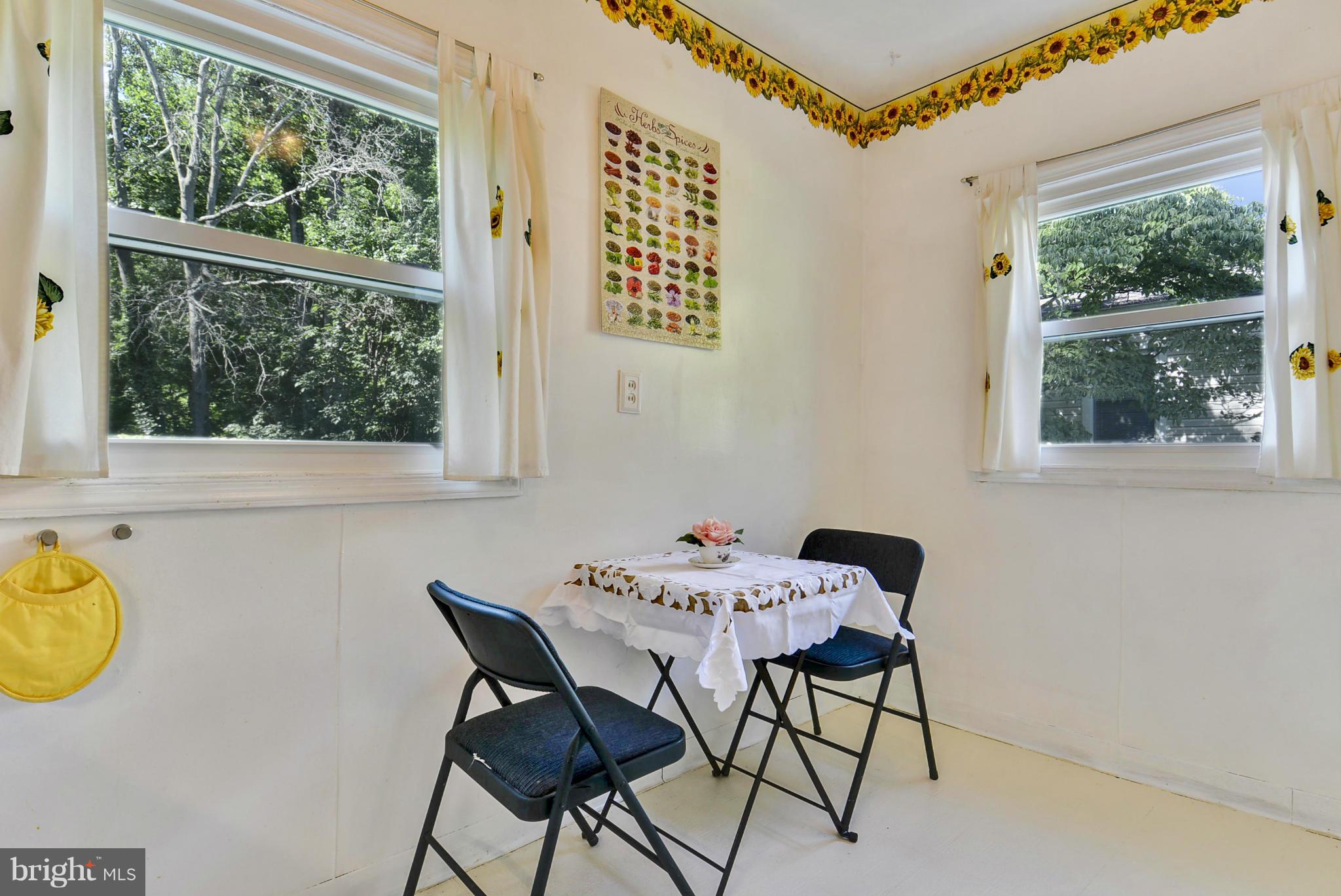 4400 Garrett Park Road Silver Spring, MD 20906 - Photo 10 of 30 a view of a dining room with a table and chairs