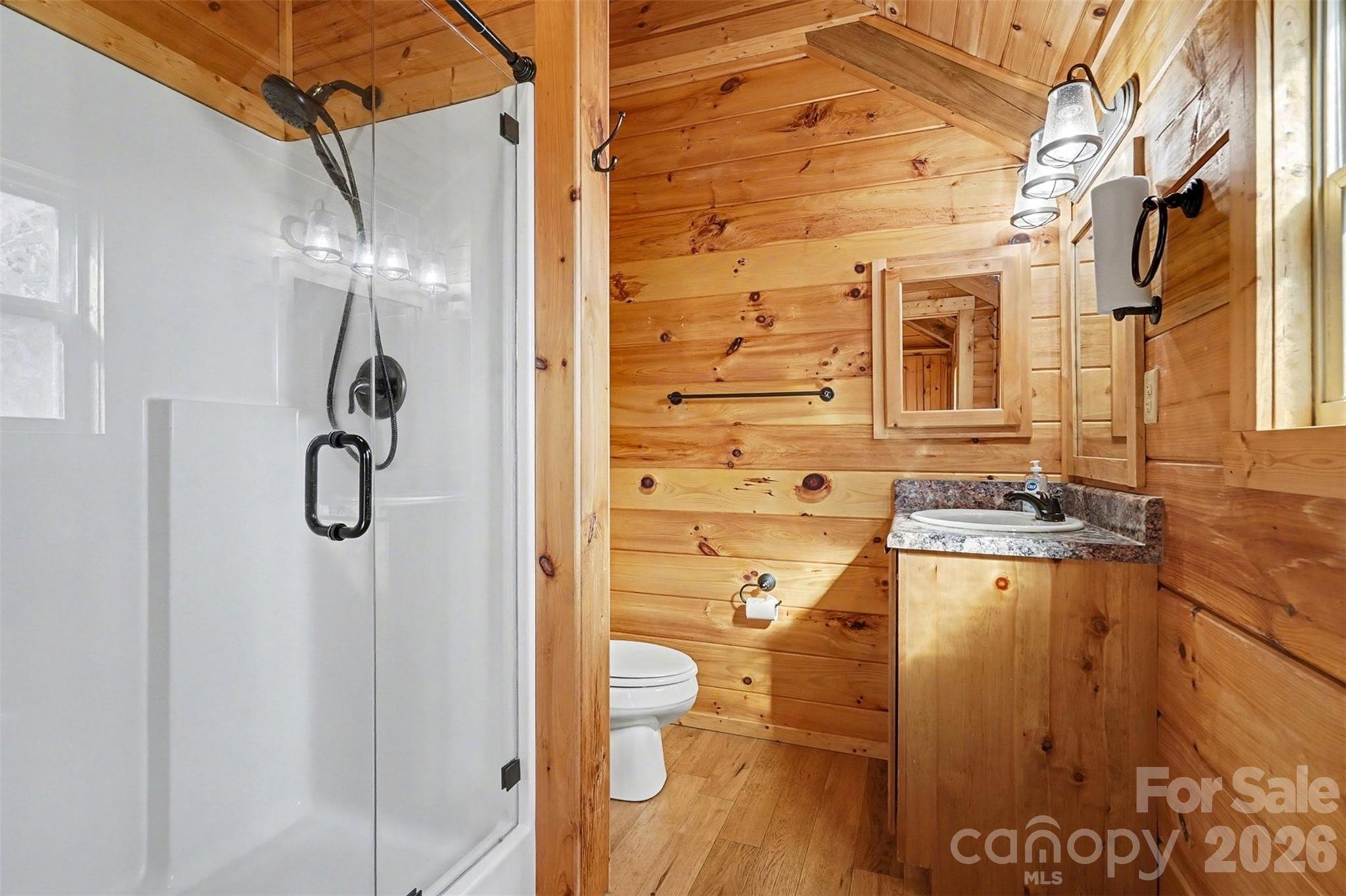 807 C E Stewart Road Clover, SC 29710 - Photo 11 of 25 a bathroom with a granite countertop shower a mirror and a sink