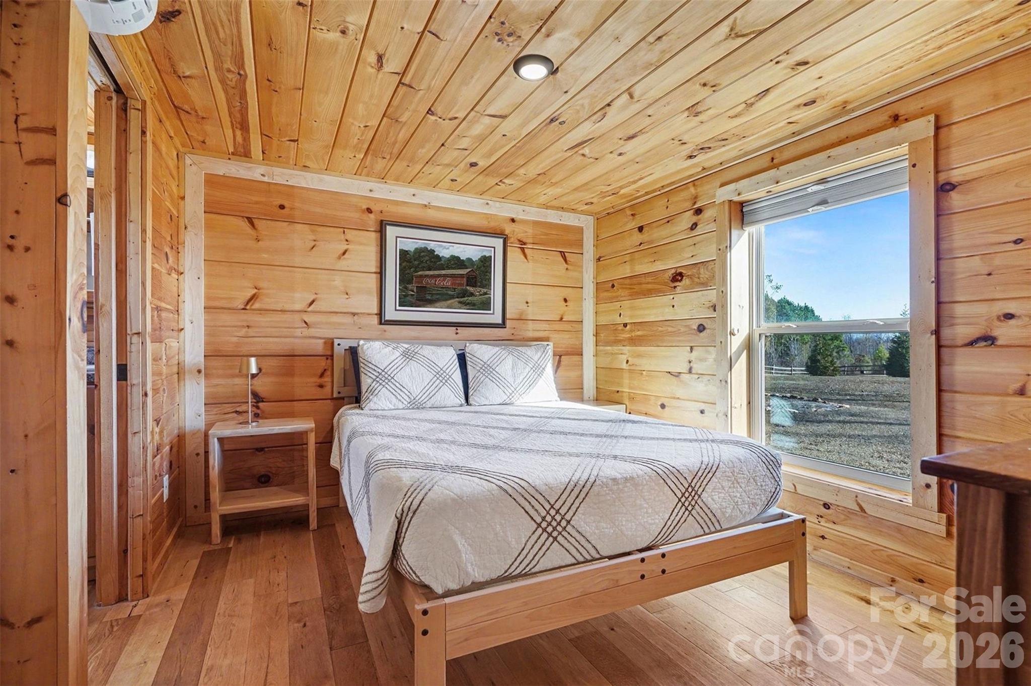 807 C E Stewart Road Clover, SC 29710 - Photo 12 of 25 a bedroom with a bed wooden floor and window