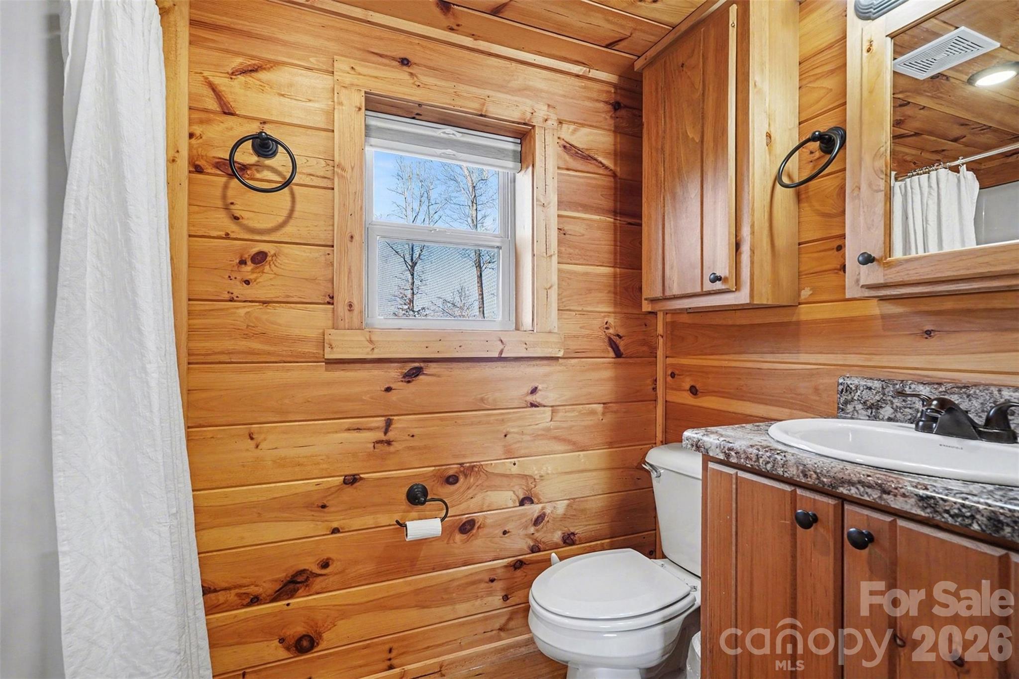 807 C E Stewart Road Clover, SC 29710 - Photo 14 of 25 a bathroom with a granite countertop toilet sink and mirror