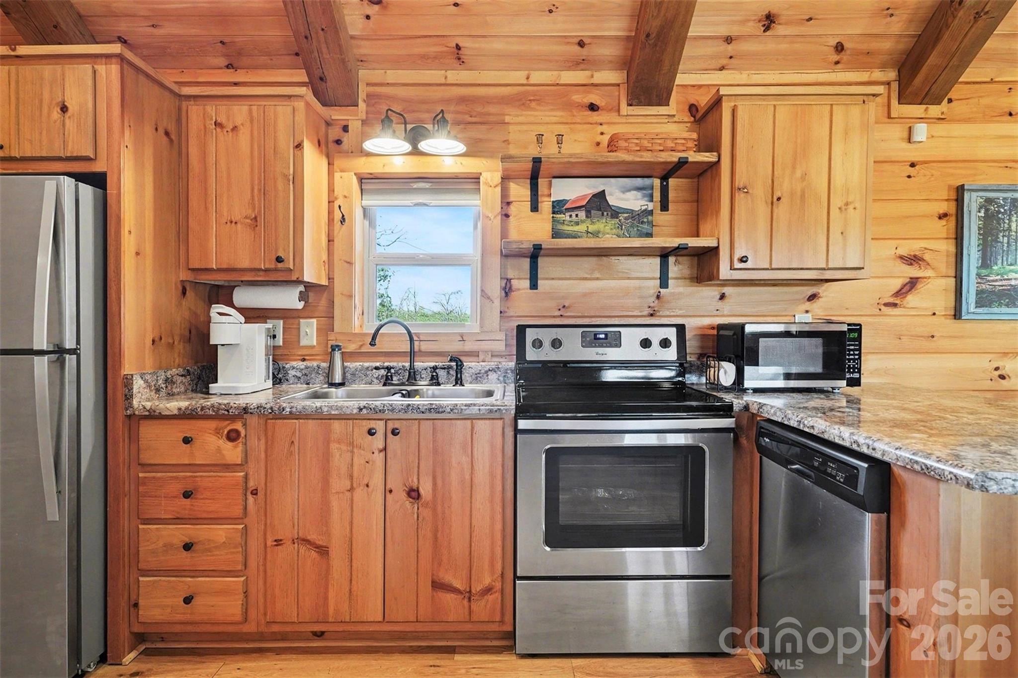 807 C E Stewart Road Clover, SC 29710 - Photo 6 of 25 a kitchen with stainless steel appliances granite countertop a stove a sink and a refrigerator