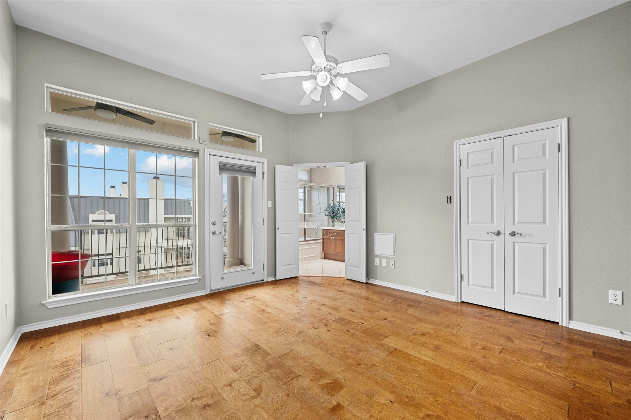 2918 Ranch To Market Road 620, Unit W219 Austin, TX 78734 - Photo 20 of 35 Natural light pours in through oversized windows in the primary bedroom - peaceful, airy, and inviting.