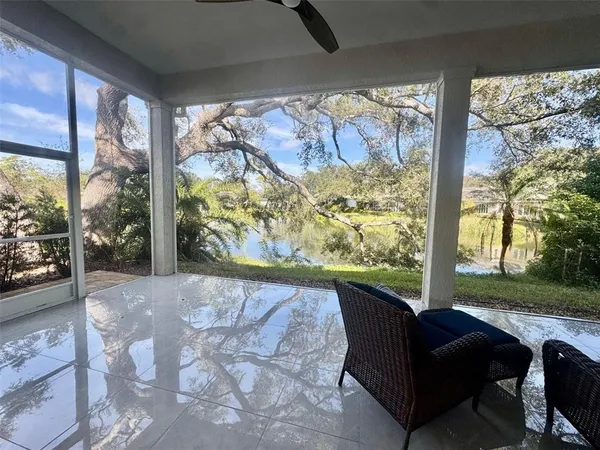 a view of a porch with furniture and yard