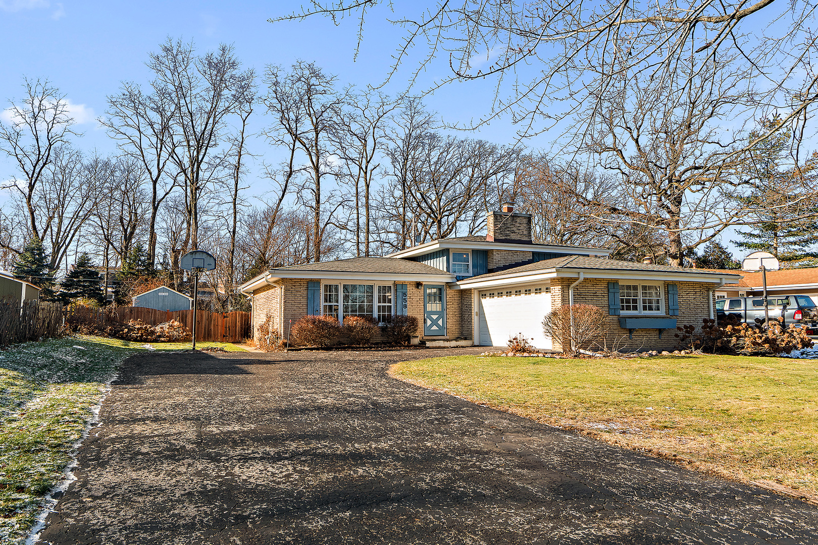 558 Birchwood Road Frankfort, IL 60423 - Photo 2 of 16 a view of a house with a yard covered in snow