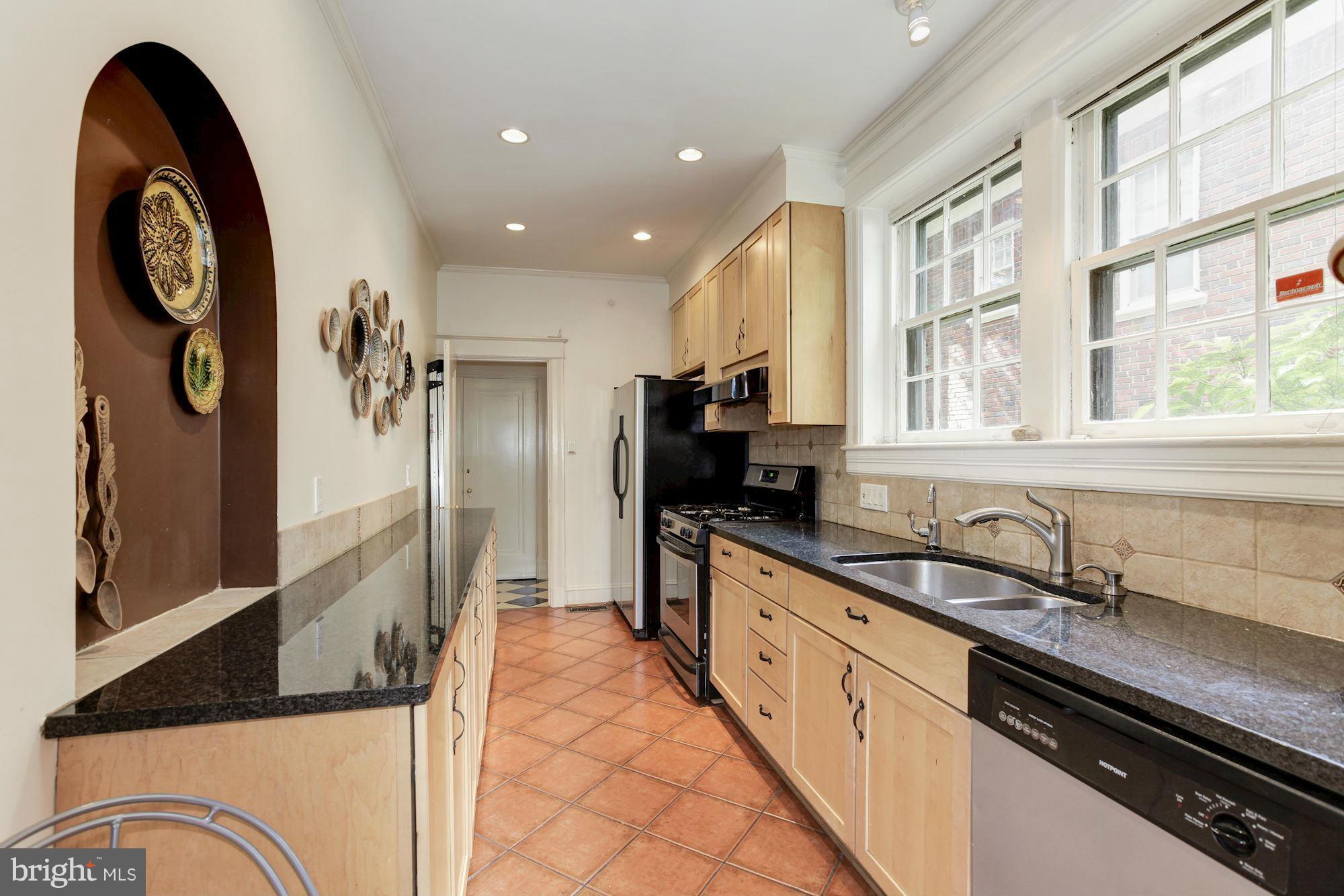 1743 Webster Street Northwest Washington, DC 20011 - Photo 11 of 24 a large kitchen with a large window