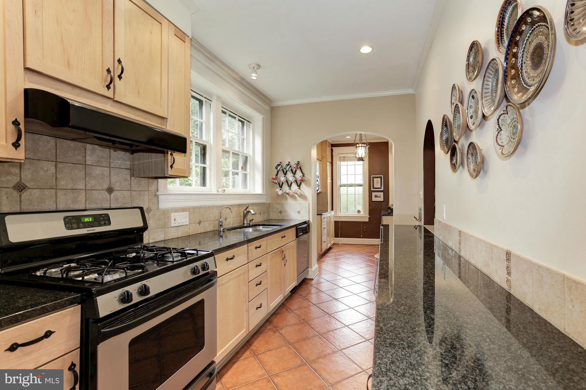 1743 Webster Street Northwest Washington, DC 20011 - Photo 12 of 24 a kitchen with granite countertop a stove and a sink