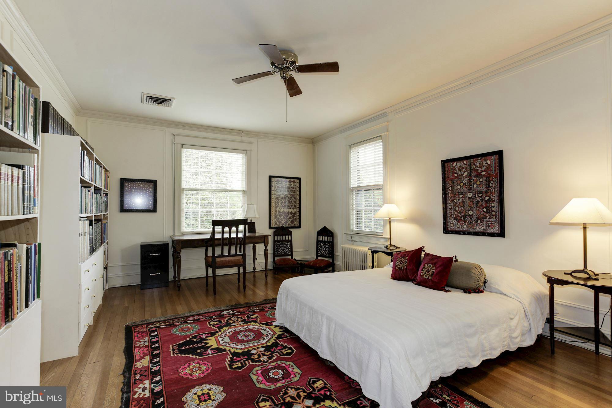 1743 Webster Street Northwest Washington, DC 20011 - Photo 15 of 24 a bedroom with a bed a table and chair