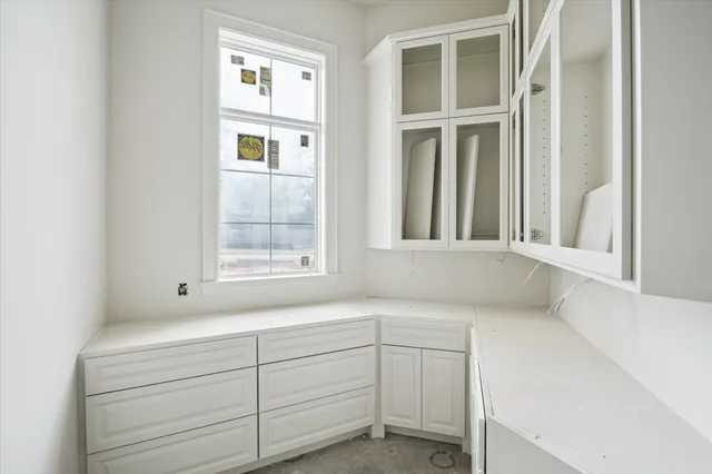 a view of cabinets and window