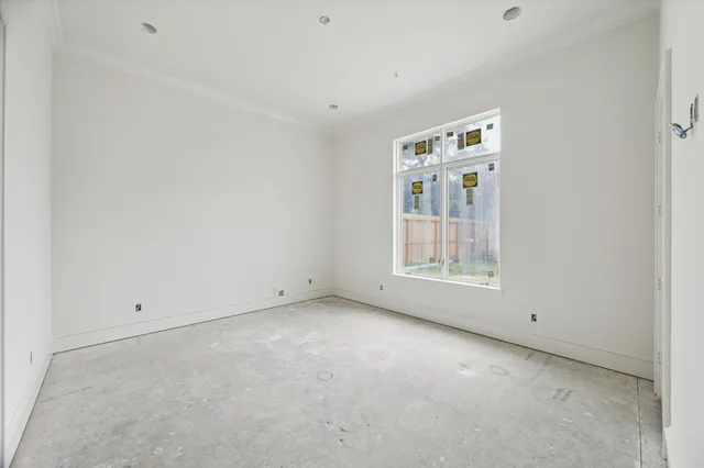 a bathroom with a bathtub and a window