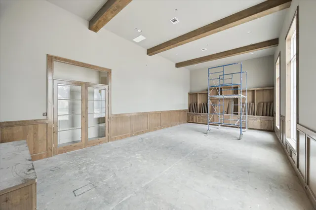 a view of an empty room with a fireplace